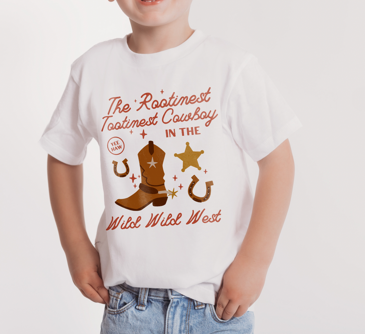 The Rootinest Tootinest Cowboy in the Wild Wild West Bella Canvas Toddler Short Sleeve Tee